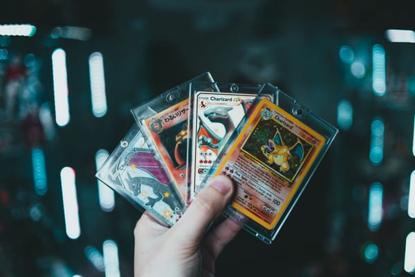 Trading cards in protective sleeves on a local card shop counter during a condition check